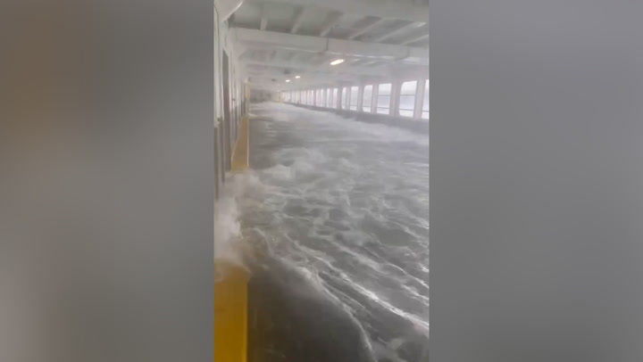 Huge waves flood ferry deck and smash against cars during Washington storm
