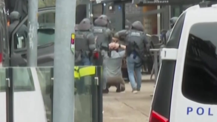 Moment man arrested by armed police after Dutch hostage situation