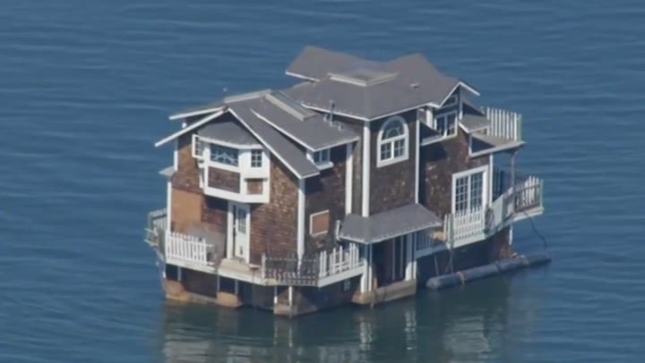 Two-storey house floats across San Francisco Bay