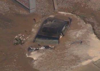 Car swallowed by muddy sinkhole in Phoenix