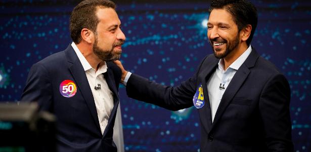 Ricardo Nunes e Guilherme Boulos se abraçam durante debate da Band